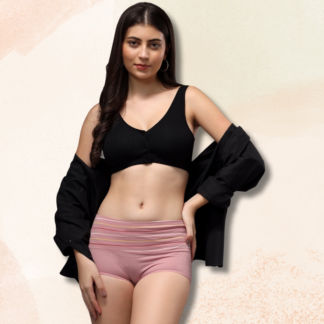 "Woman wearing a black top and pink shorts on a beige background by brachy"