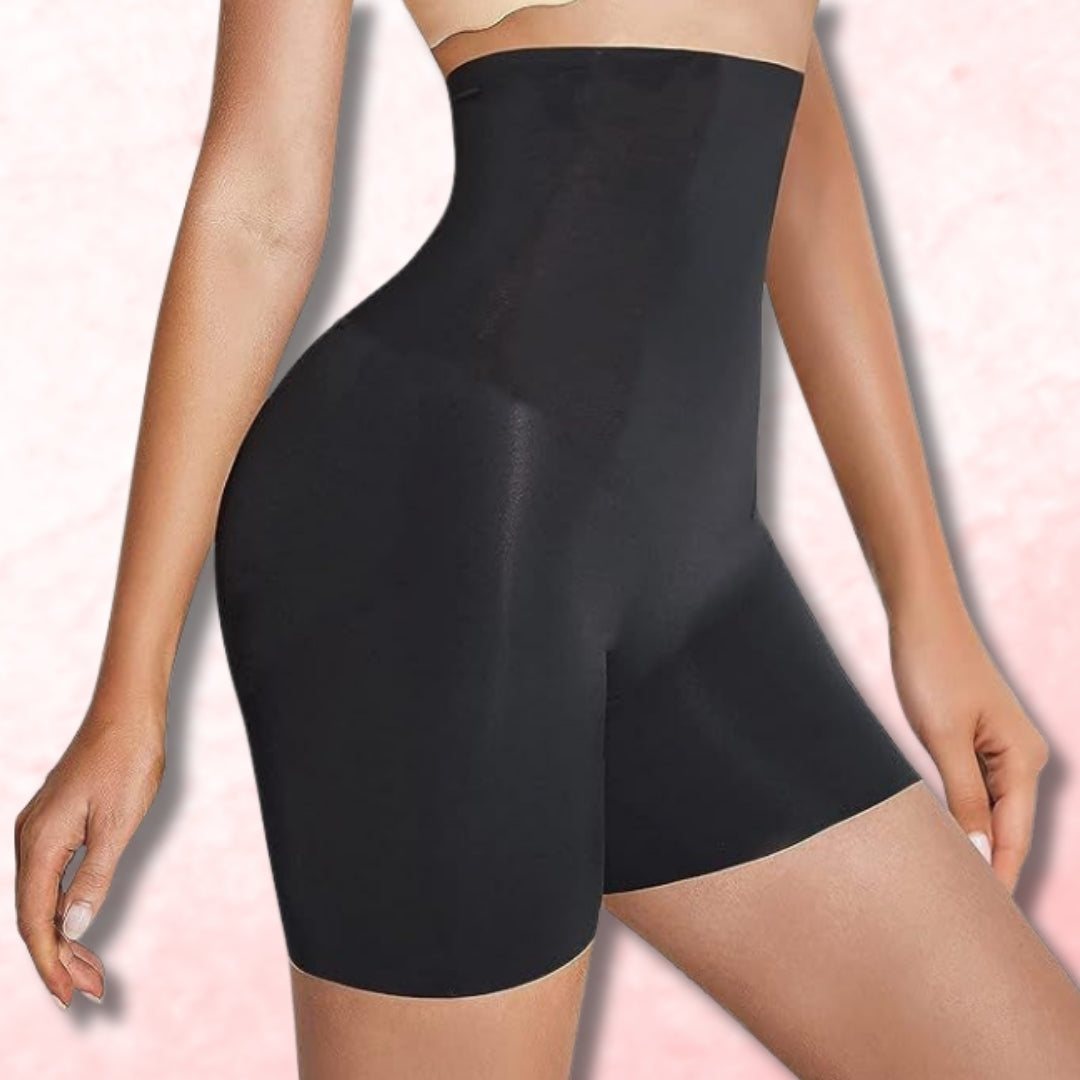 "Black shapewear shorts on a model against a light pink background by brachy"
